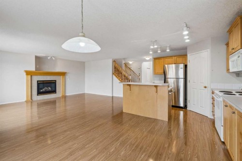 41 Panorama Hills Way Nw, Calgary, AB - Indoor Photo Showing Kitchen With Fireplace With Double Sink