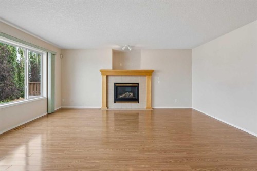 41 Panorama Hills Way Nw, Calgary, AB - Indoor Photo Showing Living Room With Fireplace