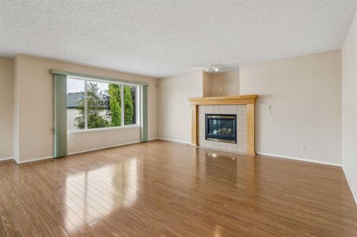 41 Panorama Hills Way Nw, Calgary, AB - Indoor Photo Showing Living Room With Fireplace