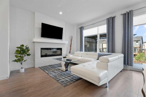 19 Cranbrook Gardens Se, Calgary, AB - Indoor Photo Showing Living Room With Fireplace