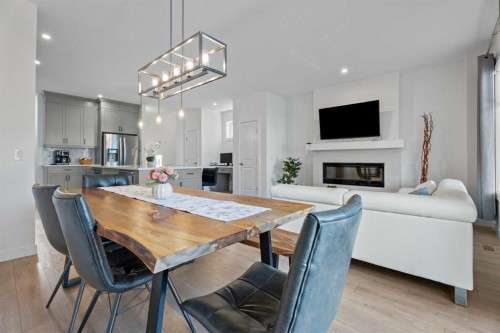 19 Cranbrook Gardens Se, Calgary, AB - Indoor Photo Showing Other Room With Fireplace