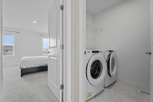 19 Cranbrook Gardens Se, Calgary, AB - Indoor Photo Showing Laundry Room