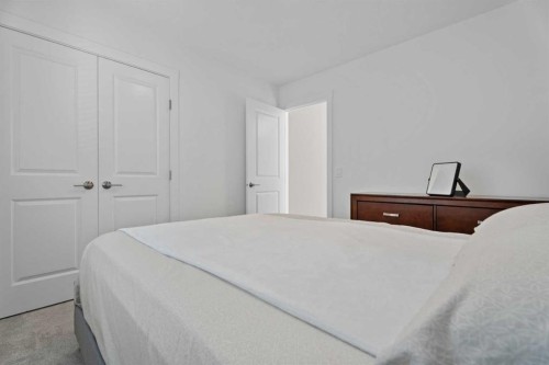 19 Cranbrook Gardens Se, Calgary, AB - Indoor Photo Showing Bedroom