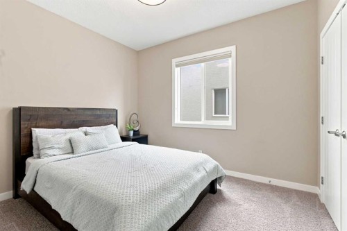 699 Cranston Avenue Se, Calgary, AB - Indoor Photo Showing Bedroom