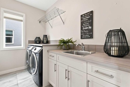 699 Cranston Avenue Se, Calgary, AB - Indoor Photo Showing Laundry Room