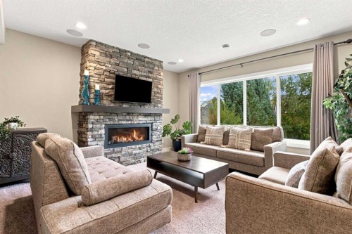 699 Cranston Avenue Se, Calgary, AB - Indoor Photo Showing Living Room With Fireplace
