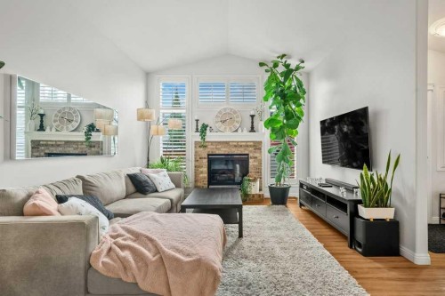 284 Prestwick Estate Way Se, Calgary, AB - Indoor Photo Showing Living Room With Fireplace