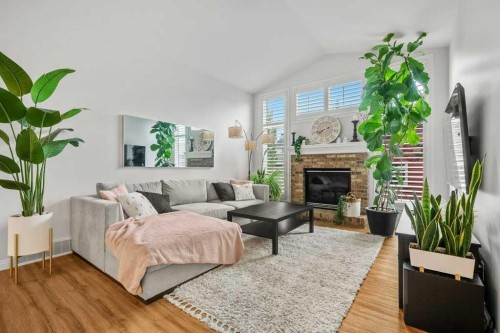 284 Prestwick Estate Way Se, Calgary, AB - Indoor Photo Showing Living Room With Fireplace