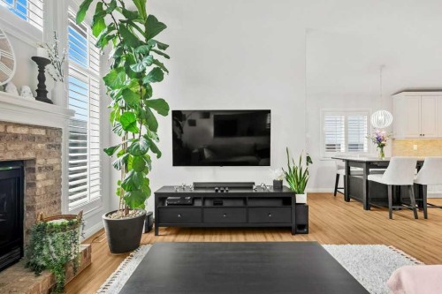 284 Prestwick Estate Way Se, Calgary, AB - Indoor Photo Showing Living Room With Fireplace