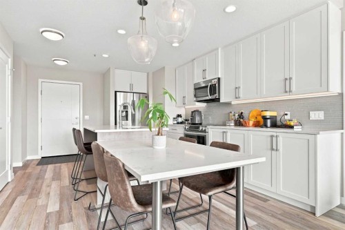 320-8530 8A Avenue Sw, Calgary, AB - Indoor Photo Showing Kitchen With Stainless Steel Kitchen With Upgraded Kitchen