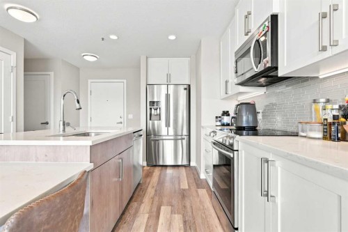 320-8530 8A Avenue Sw, Calgary, AB - Indoor Photo Showing Kitchen With Stainless Steel Kitchen With Upgraded Kitchen