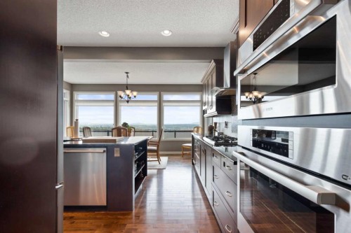 159 Sunset View, Cochrane, AB - Indoor Photo Showing Kitchen With Stainless Steel Kitchen With Upgraded Kitchen