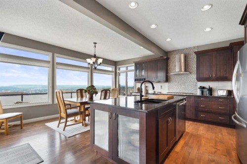 159 Sunset View, Cochrane, AB - Indoor Photo Showing Kitchen With Upgraded Kitchen