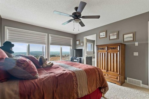 159 Sunset View, Cochrane, AB - Indoor Photo Showing Bedroom