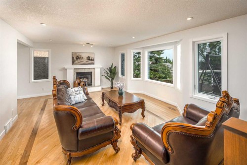 2612 Signal Hill Drive Sw, Calgary, AB - Indoor Photo Showing Living Room With Fireplace