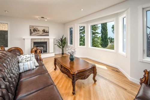 2612 Signal Hill Drive Sw, Calgary, AB - Indoor Photo Showing Living Room With Fireplace