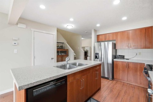 26 Copperpond Place Se, Calgary, AB - Indoor Photo Showing Kitchen With Double Sink