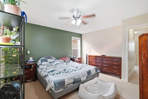 26 Copperpond Place Se, Calgary, AB - Indoor Photo Showing Bedroom