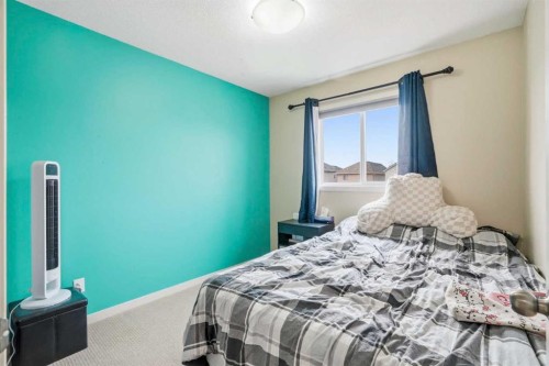 26 Copperpond Place Se, Calgary, AB - Indoor Photo Showing Bedroom