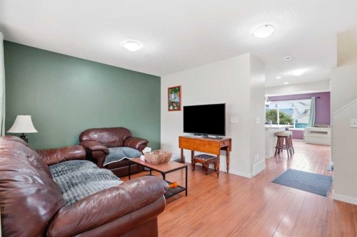 26 Copperpond Place Se, Calgary, AB - Indoor Photo Showing Living Room