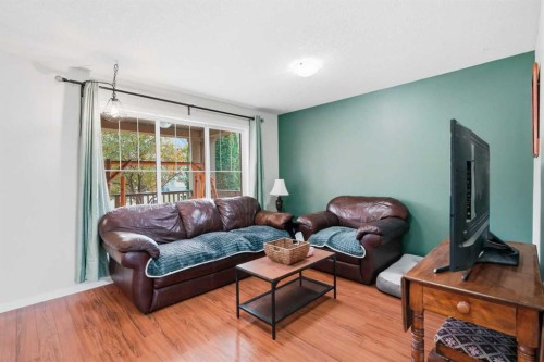 26 Copperpond Place Se, Calgary, AB - Indoor Photo Showing Living Room