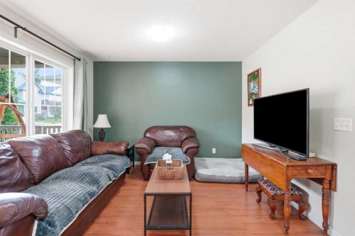 26 Copperpond Place Se, Calgary, AB - Indoor Photo Showing Living Room