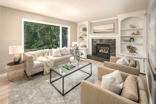 79 Hamptons Heights Nw, Calgary, AB - Indoor Photo Showing Living Room With Fireplace