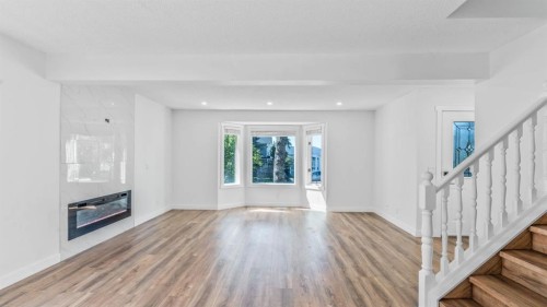 15 Taraglen Court Ne, Calgary, AB - Indoor With Fireplace