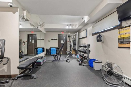320-11 Millrise Drive Sw, Calgary, AB - Indoor Photo Showing Gym Room