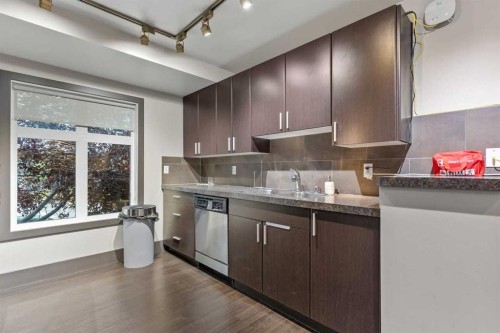320-11 Millrise Drive Sw, Calgary, AB - Indoor Photo Showing Kitchen With Double Sink