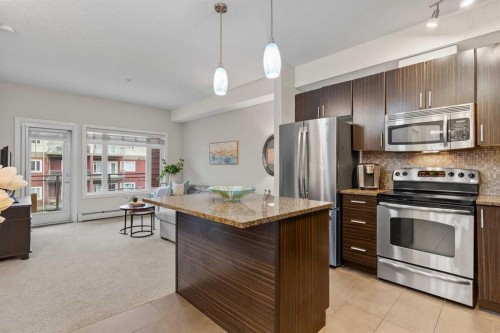 320-11 Millrise Drive Sw, Calgary, AB - Indoor Photo Showing Kitchen With Stainless Steel Kitchen With Upgraded Kitchen