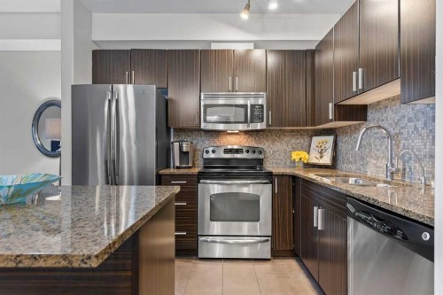 320-11 Millrise Drive Sw, Calgary, AB - Indoor Photo Showing Kitchen With Stainless Steel Kitchen With Double Sink With Upgraded Kitchen