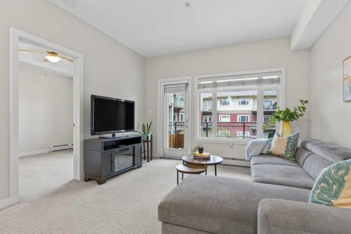 320-11 Millrise Drive Sw, Calgary, AB - Indoor Photo Showing Living Room