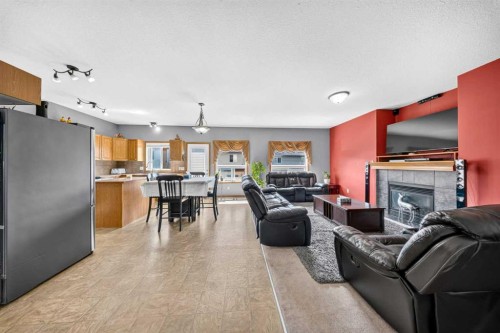 154 Saddleland Close Ne, Calgary, AB - Indoor Photo Showing Living Room With Fireplace