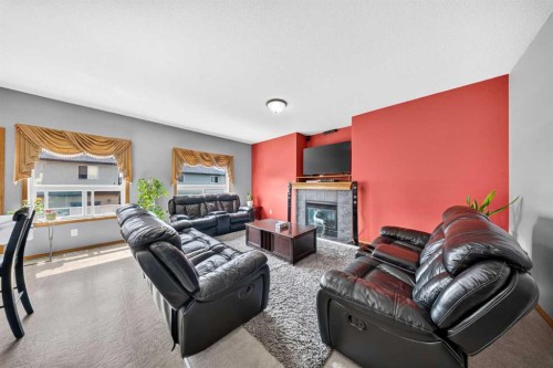 154 Saddleland Close Ne, Calgary, AB - Indoor Photo Showing Living Room With Fireplace