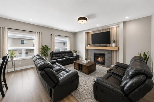 154 Saddleland Close Ne, Calgary, AB - Indoor Photo Showing Living Room With Fireplace