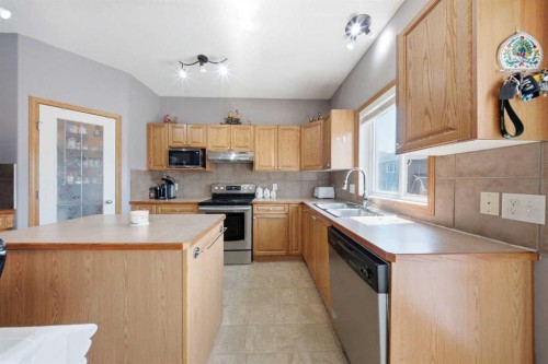 154 Saddleland Close Ne, Calgary, AB - Indoor Photo Showing Kitchen With Double Sink