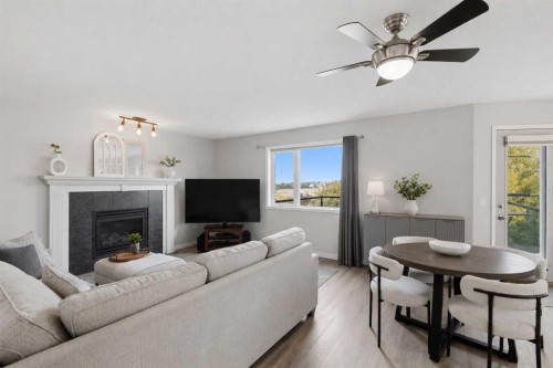 122 Sceptre Close Nw, Calgary, AB - Indoor Photo Showing Living Room With Fireplace