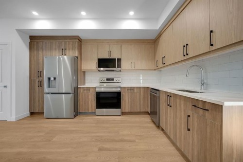 612 12 Avenue Ne, Calgary, AB - Indoor Photo Showing Kitchen With Stainless Steel Kitchen With Double Sink