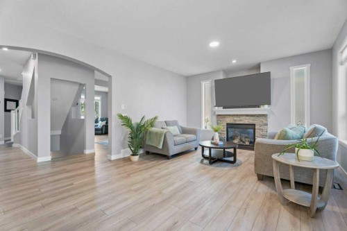 100 Drake Landing Common, Okotoks, AB - Indoor Photo Showing Living Room With Fireplace