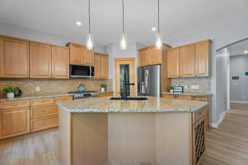 100 Drake Landing Common, Okotoks, AB - Indoor Photo Showing Kitchen With Upgraded Kitchen