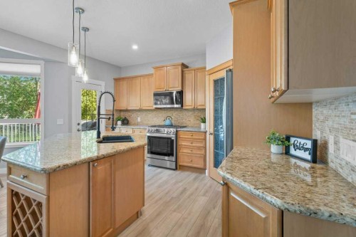 100 Drake Landing Common, Okotoks, AB - Indoor Photo Showing Kitchen With Stainless Steel Kitchen With Double Sink With Upgraded Kitchen