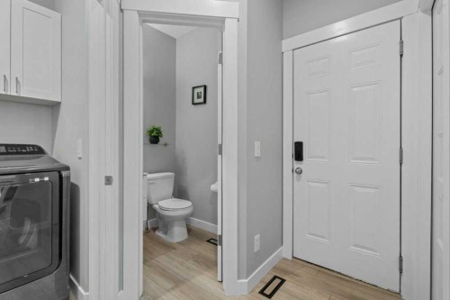 100 Drake Landing Common, Okotoks, AB - Indoor Photo Showing Laundry Room