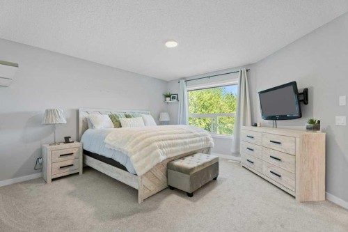 100 Drake Landing Common, Okotoks, AB - Indoor Photo Showing Bedroom