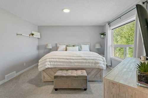 100 Drake Landing Common, Okotoks, AB - Indoor Photo Showing Bedroom