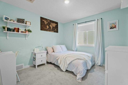 100 Drake Landing Common, Okotoks, AB - Indoor Photo Showing Bedroom