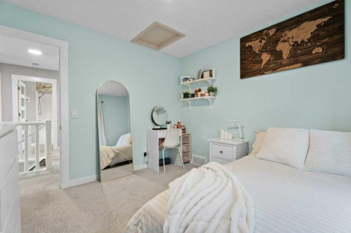 100 Drake Landing Common, Okotoks, AB - Indoor Photo Showing Bedroom