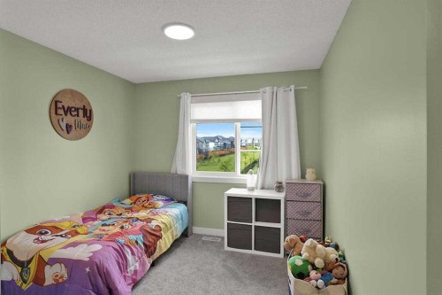 1139 Lanark Boulevard Se, Airdrie, AB - Indoor Photo Showing Bedroom