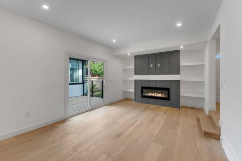 816 Lake Ontario Drive Se, Calgary, AB - Indoor Photo Showing Living Room With Fireplace