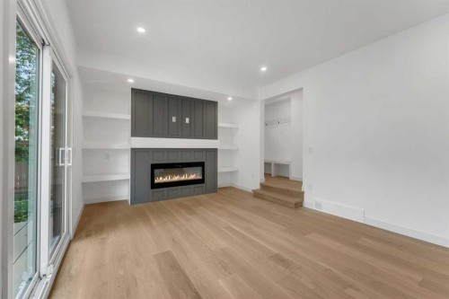 816 Lake Ontario Drive Se, Calgary, AB - Indoor Photo Showing Living Room With Fireplace
